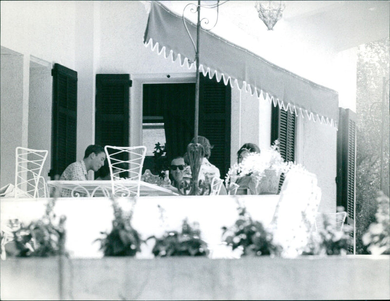 David Niven spends his summer holidays in Saint Jean Cap Ferrat with his family and hosts Lawrence Olivier and his wife Jean Plowright - Vintage Photograph