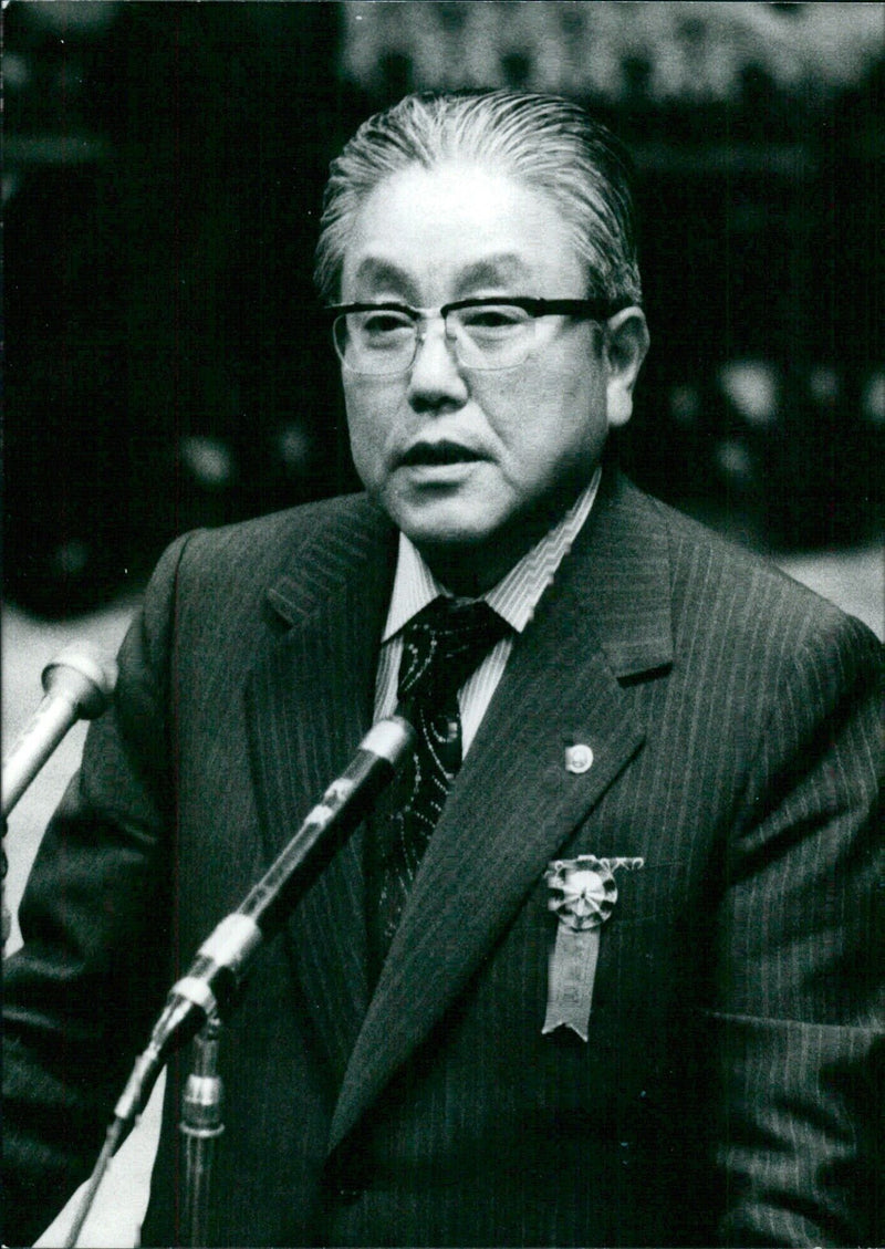 NAOJI WATANABE, Vice President of ANA, being questioned by the Lower House Budget Committee on the Lockheed bribes case in February 1976. - Vintage Photograph