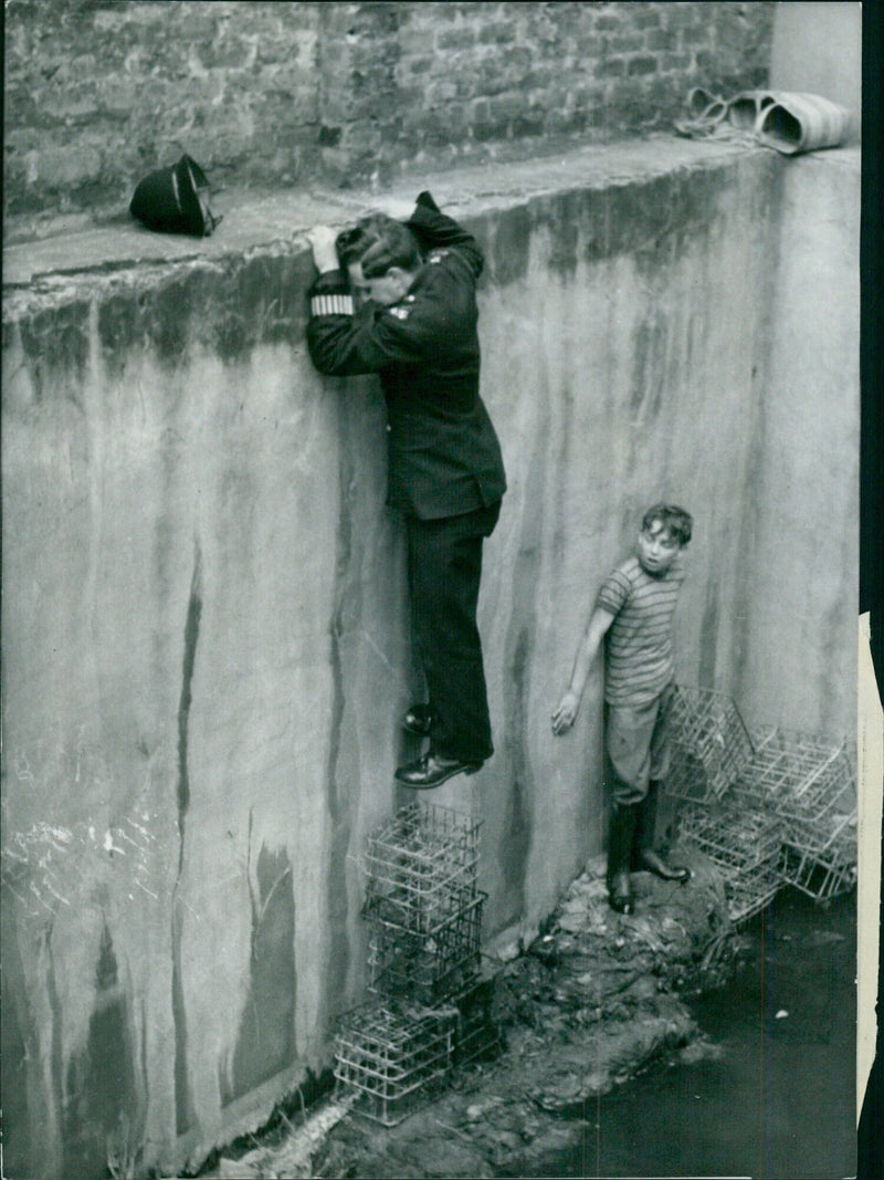 Police help boy rescue kitten in London - Vintage Photograph