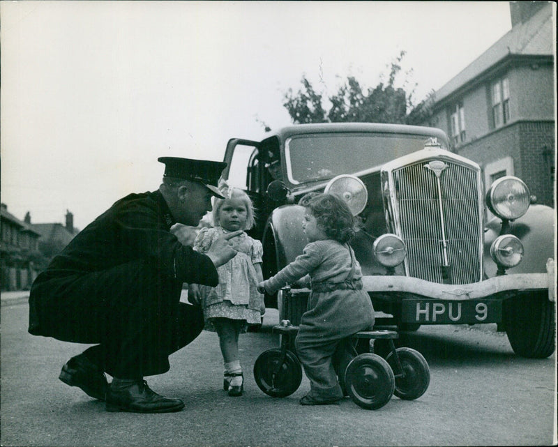 Policeman teaching children road safety - Vintage Photograph