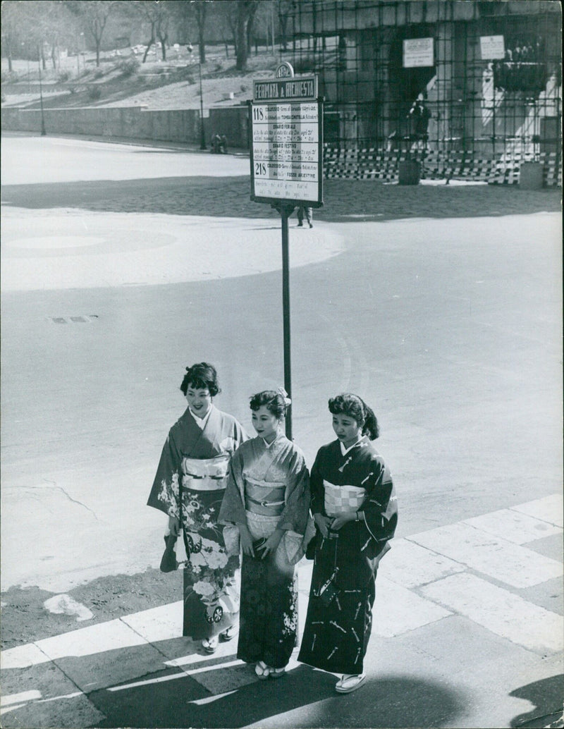 Japanese tourists waiting for a bus in Rome - Vintage Photograph