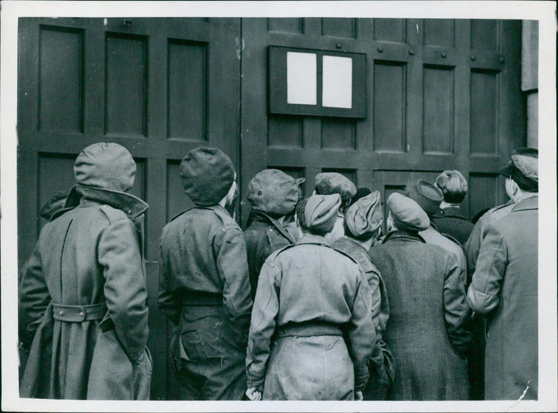 Soldiers reading the notice proclaiming the hanging had taken place - Vintage Photograph