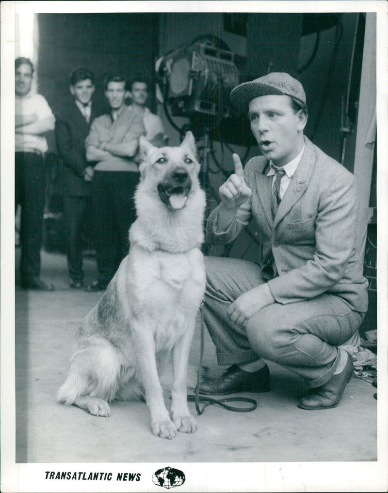 Norman Wisdom arrives late for a meeting - Vintage Photograph