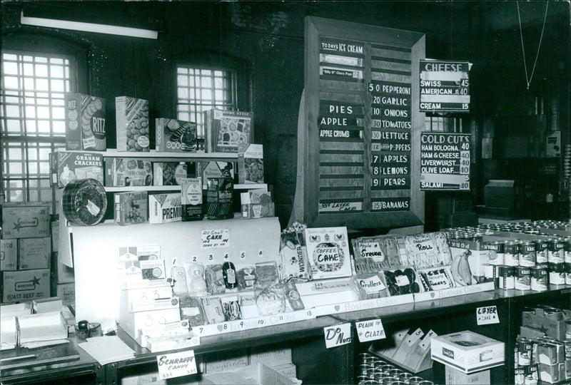 Various food products on display in a supermarket - Vintage Photograph