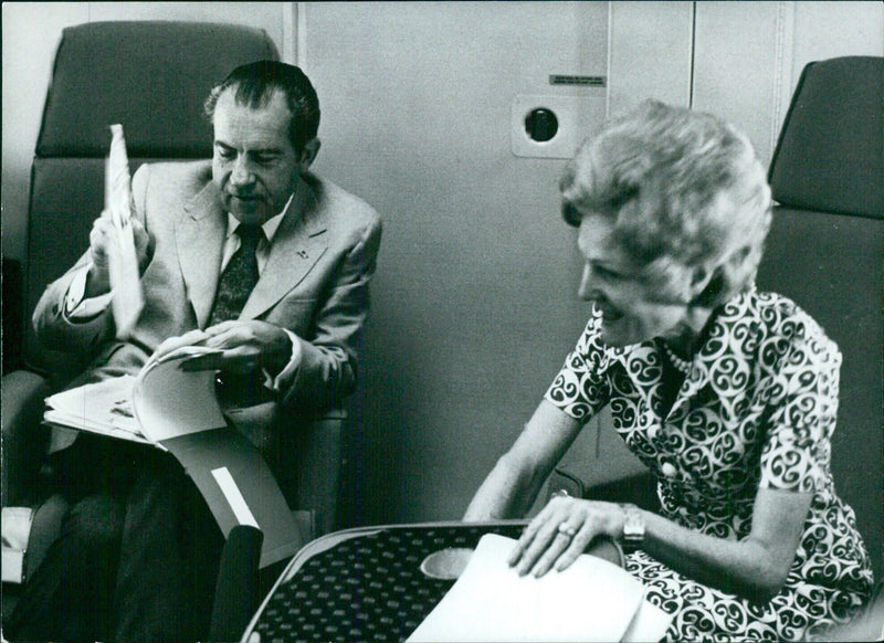 President and Mrs. Richard Nixon on board aircraft to China, 1972 - Vintage Photograph