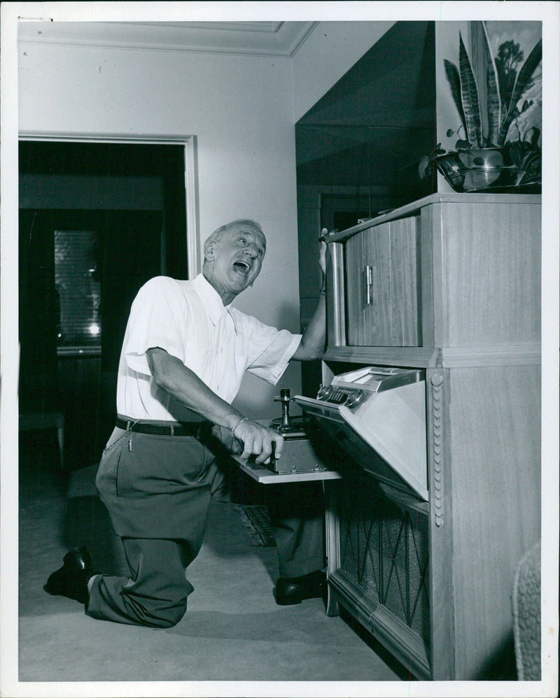 Jimmy Durante enjoying a day of rest at his home in Beverly Hills - Vintage Photograph