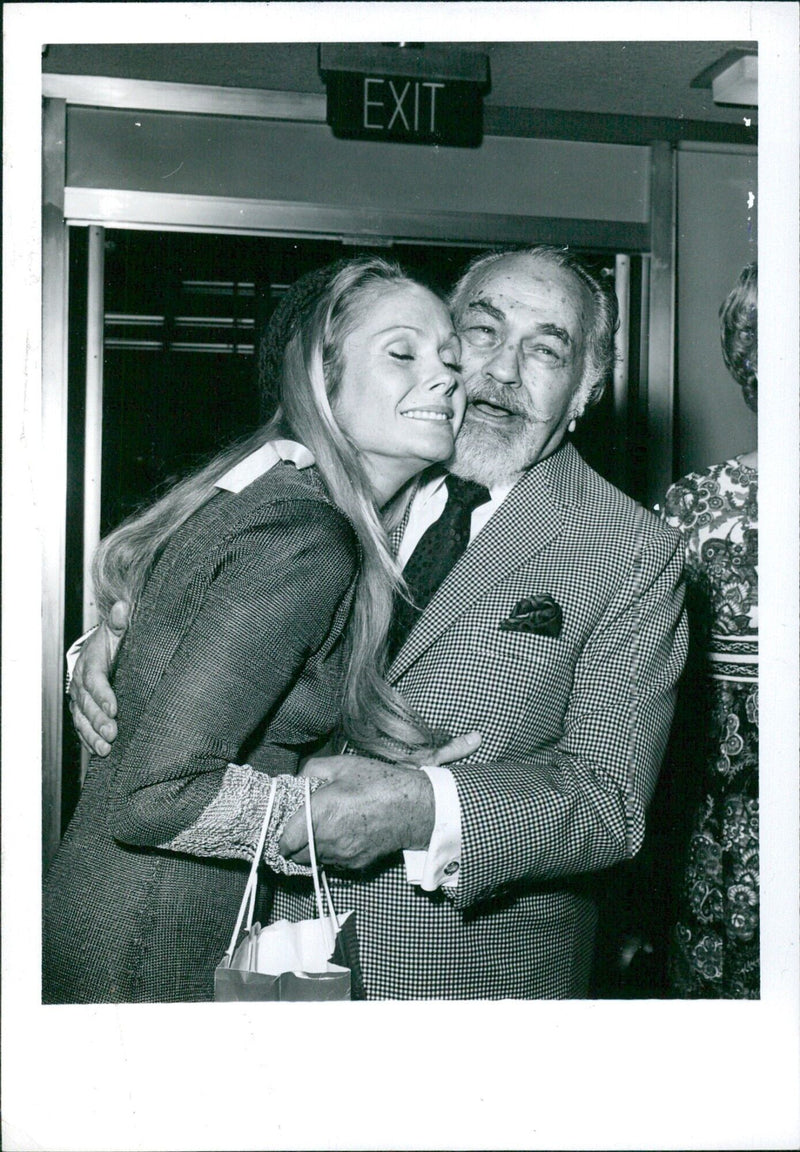 Edward G. Robinson greets Felicia Farr at the charity premiere of "Plaza Suite" - Vintage Photograph