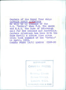 Captain David Aitchison, commander of the S.S. "Gothic", prepares to sail with Queen Elizabeth II and Prince Philip to New Zealand and Australia. - Vintage Photograph