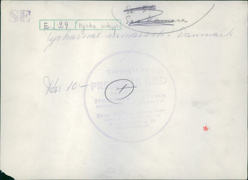 German military men marching along the streets of Denmark. - Vintage Photograph