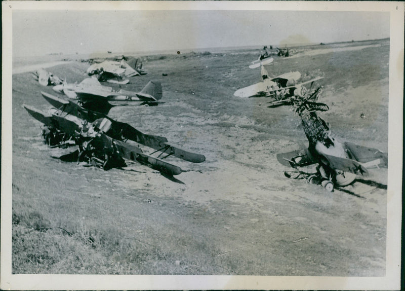 Airport in Minsk the Russians a war graveyard. Beaten in the air at the bottom
A cemetery of Soviet aircraft, the airfield in Minsk. 1942 - Vintage Photograph