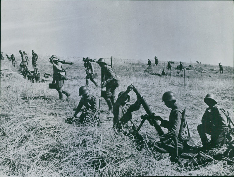 Infantry goes with grenades and over. The infantry is the Bulgarians. 1940 - Vintage Photograph