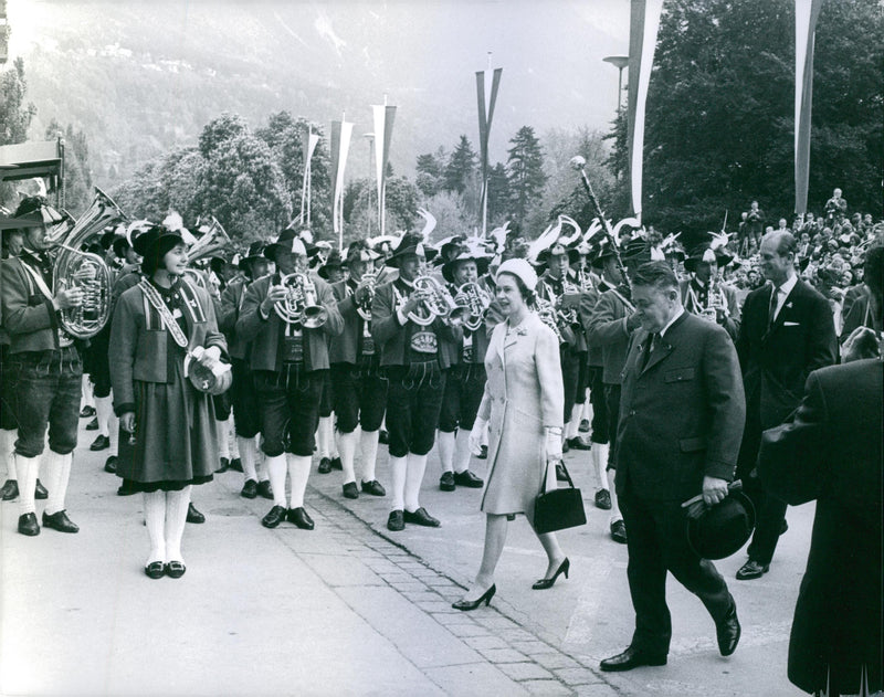 Elizabeth II passing by the street, musicians welcoming her by playing music. - Vintage Photograph