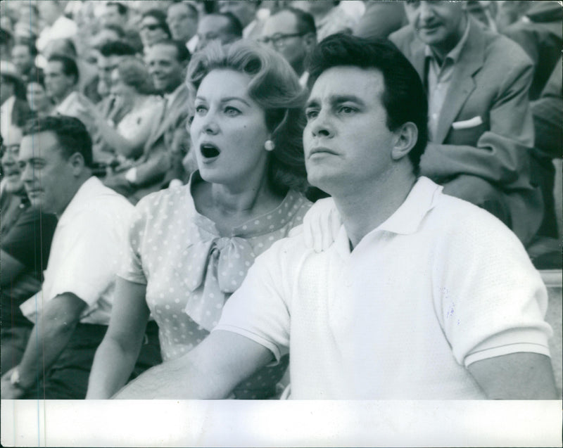 Rhonda Fleming with her husband looking at show.Darol Wayne Carlson. - Vintage Photograph