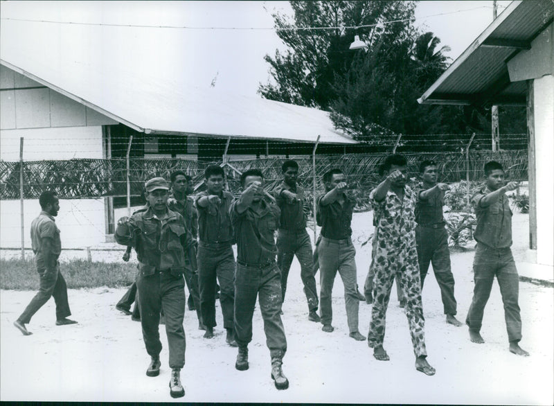 Vintage photo of soldiers on their marching exercise in New Guinea. Photo taken on May 28, 1962. - Vintage Photograph