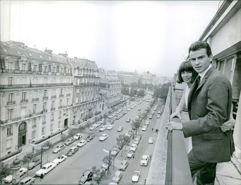 German actor Horst Buchholz have stood on the top of the building with his wife French actress Myriam Bru, they have looked towards the camera - Vintage Photograph