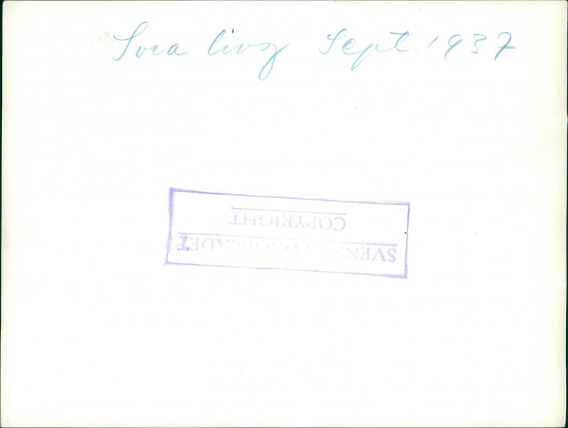 September 1937
A photo of military men standing preparing during an event. - Vintage Photograph