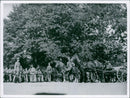 September 1937
A photo of military men standing preparing during an event. - Vintage Photograph