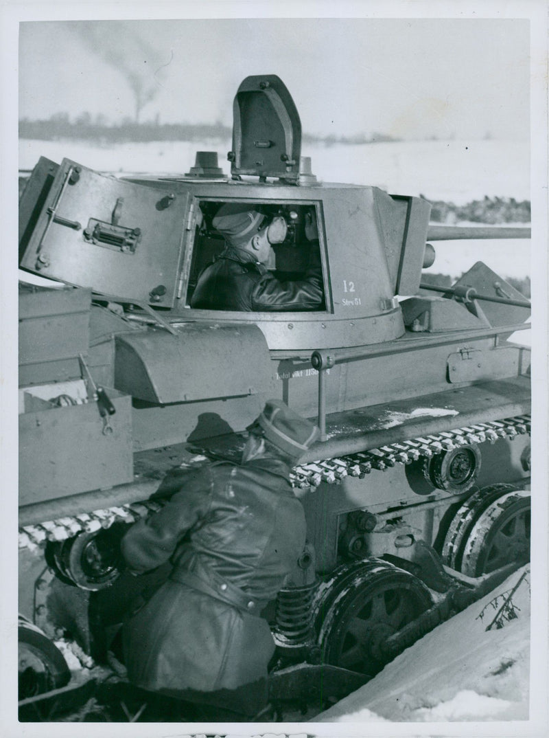 A tank with crew during winter. - Vintage Photograph