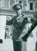 Military man standing and directing the army band group. - Vintage Photograph