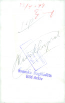 Military musical group standing and playing band.

" Music __"
 - 23 April 1949 - Vintage Photograph