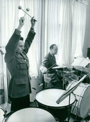 Music Sergeant Per-Anders Erixon manages toms with jermitet and powerful elegance. The percussion in the background shot of music sergeant Sture Englund - Vintage Photograph