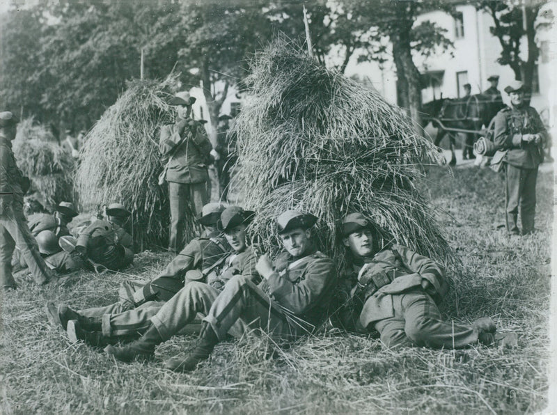 The renewed infantry. Troops taking a break during field control - Vintage Photograph