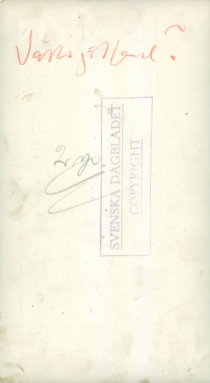 Svea Life Guards gathered operating a machine. - Vintage Photograph