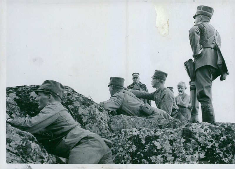 Landscape cadets behind a rock with the battalion commander at the Karlberg military school. - Vintage Photograph