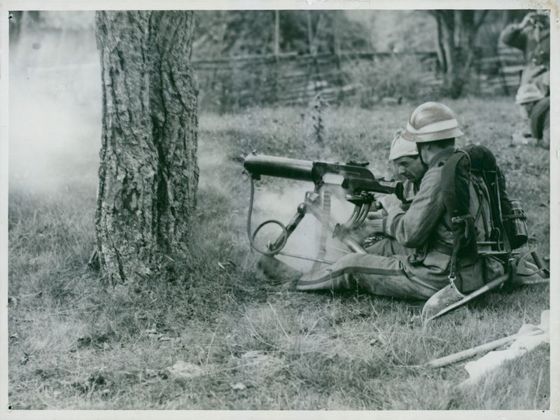 Machine gun in action during a fieldoperation. - Vintage Photograph