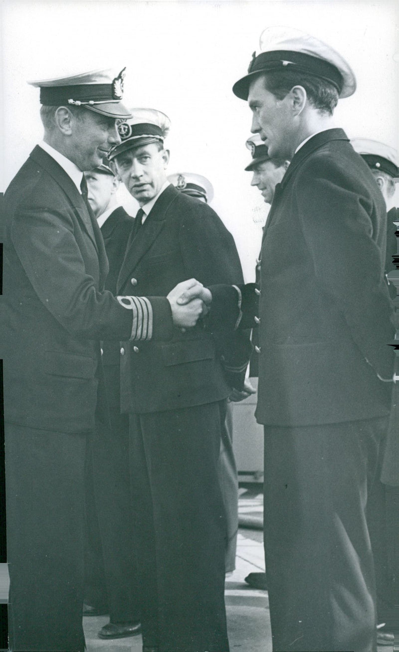 GÃ¶ta Lejon's commander, commander Evert Lindh, greets his sub-officer after the flag ceremony. - 13 August 1947 - Vintage Photograph