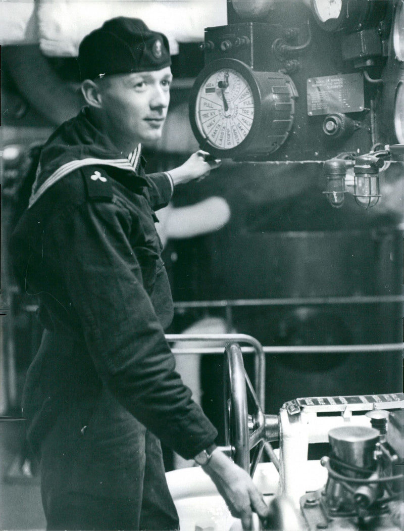 Navy officer in the engine room of HSwMS GÃ¶ta Lejon. - Vintage Photograph