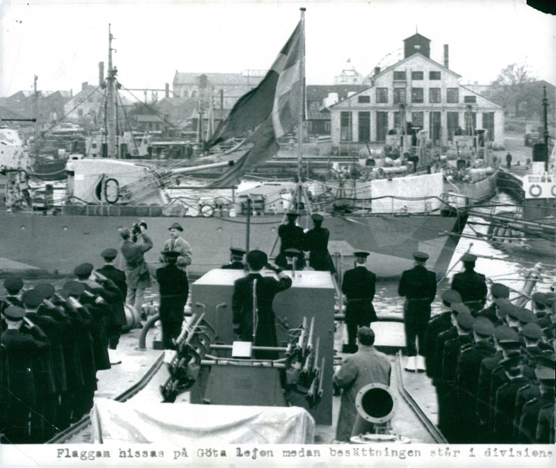 The flag of Hissas on GÃ¶ta Lejon medasn crew is in division at the embassy ceremony - Vintage Photograph