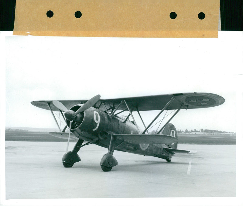 Fiat CR.42 Falco aka J11 biplane intended as a fighter aircraft on the hangar plate - Vintage Photograph