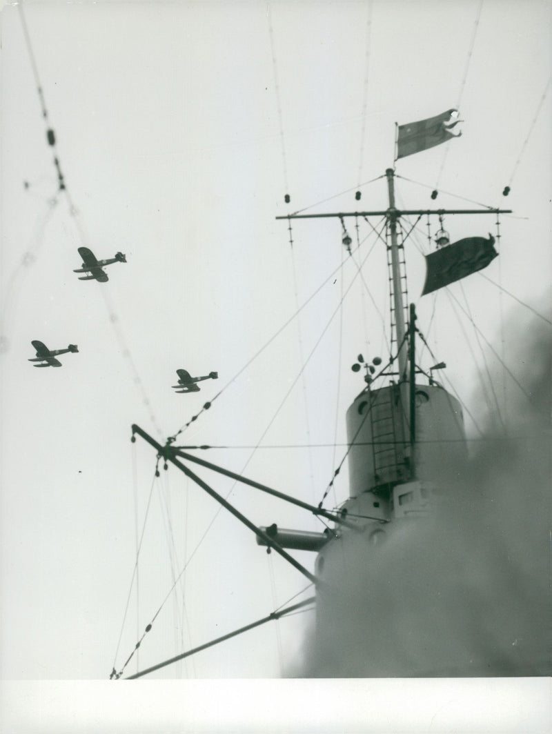 Aircraft flying over the ship during the aviation maneuver in 1932. - Vintage Photograph
