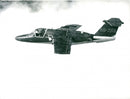 A Saab 105XT two-seater jet aircraft in the air. - Vintage Photograph
