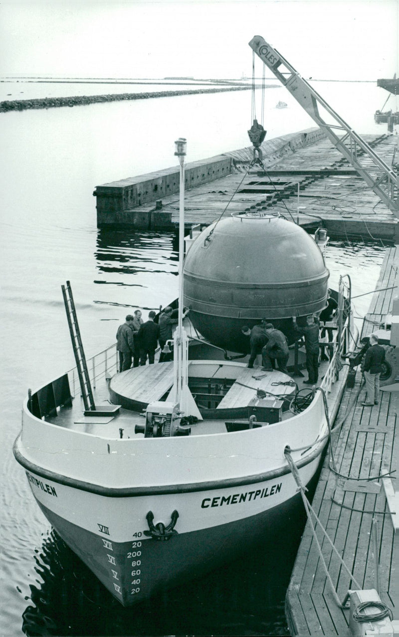 Cement Bowl lifted aboard a specialized vessel. - Vintage Photograph