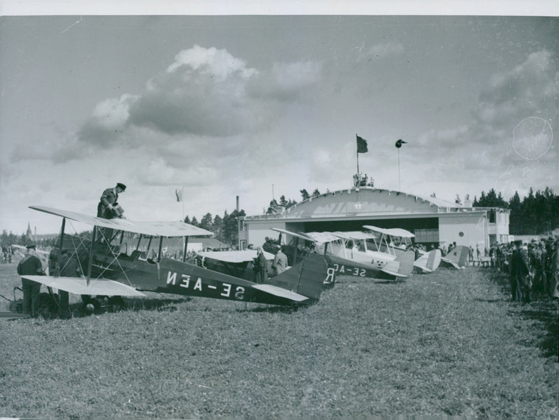 Aircraft outside the newly built hangar - Year 1930 - Vintage Photograph