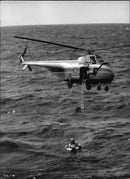 The Navy combat demonstration with helicopter rescue of a man overboard from the destroyer - Vintage Photograph