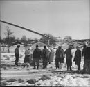 Helicopter party premiere, at the airfield, people watching in snow - Vintage Photograph