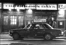 A taxi outside the English pub The Golden Days in Gothenburg. - Vintage Photograph