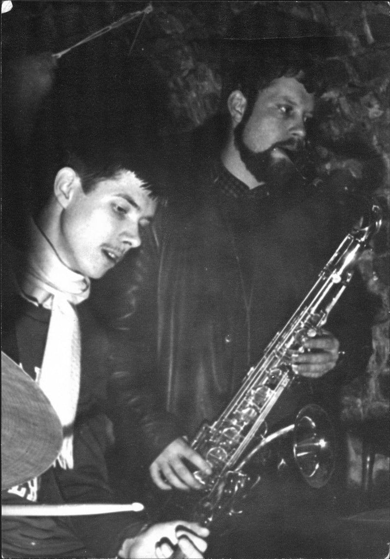 Musicians playing drums and saxophone in a nightclub - Vintage Photograph