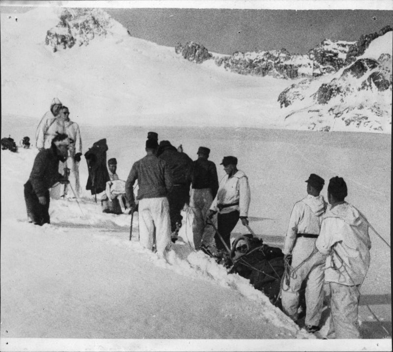 Passengers carried out in sledges by Swiss soldiers from the accident scene on Gauliglacier - Vintage Photograph