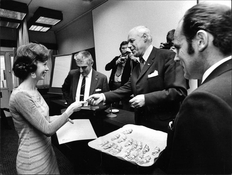 Newly-graduated female pursers Ulla Callermo gets her wings by the managers Lars LovÃ©n, Dan Pieschewski and Gunnar Maeland - Vintage Photograph