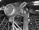 Aircraft Mechanic Lars Killin finalize Saab's fighter J 29. - Vintage Photograph
