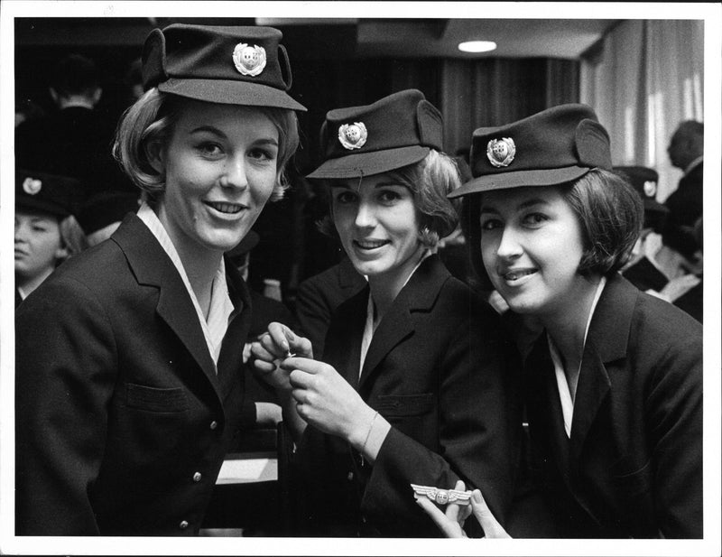 Three newly trained flight attendants with their wings, from the City of Stockholm's vocational school. - Vintage Photograph