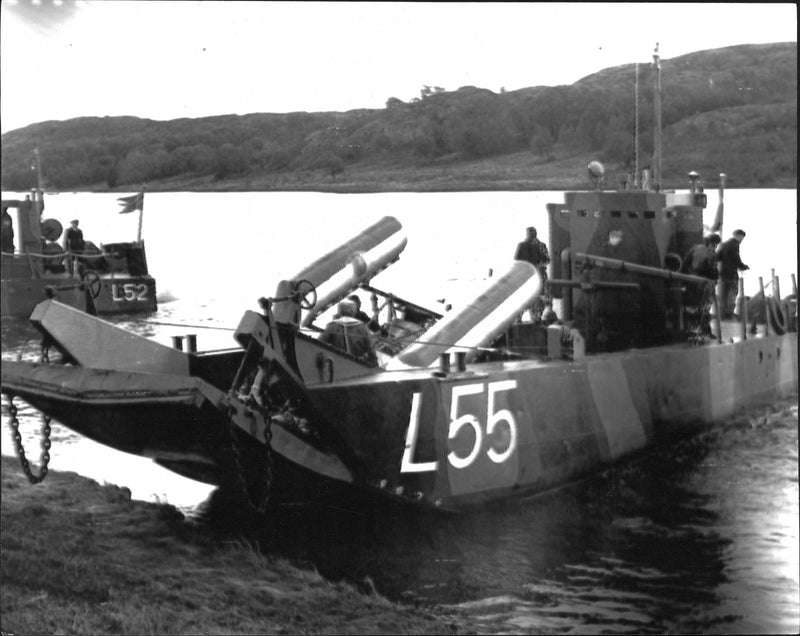 One of the Navy's landing boats ashore wreckage of the helicopter. - Vintage Photograph