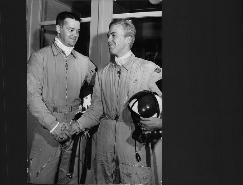 Roland Jonsson and Ingvar Larsson shake hands after they rescued a parachute at the J28C hunt plane's accident - Vintage Photograph