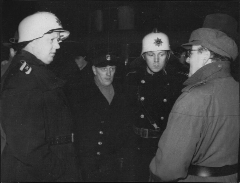 Fire chief and police superintendent in conversation after the Danish passenger plane accident in Ãresund. - Vintage Photograph