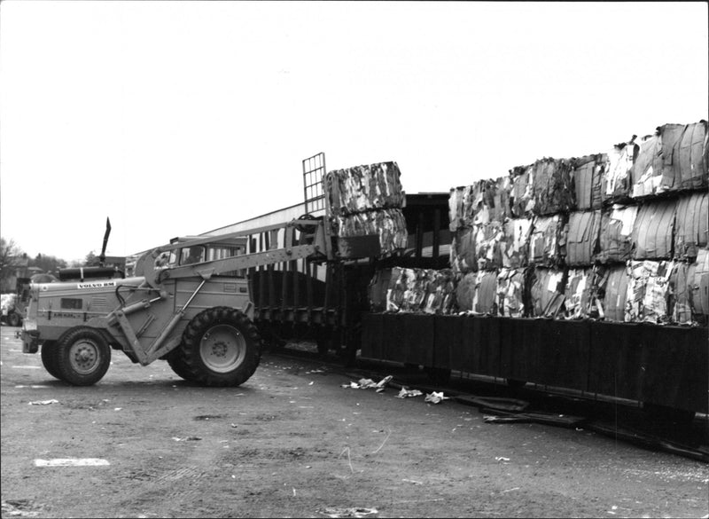 A Volvo BM loading paper bales of paper. - Vintage Photograph