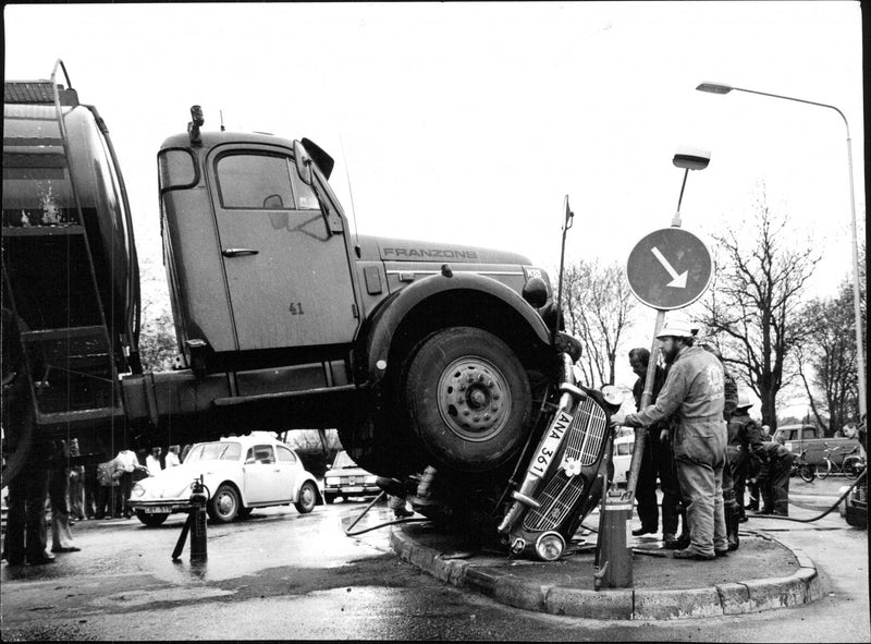 The tanker climbed up on the passenger car at the collision. No one was seriously injured - Vintage Photograph